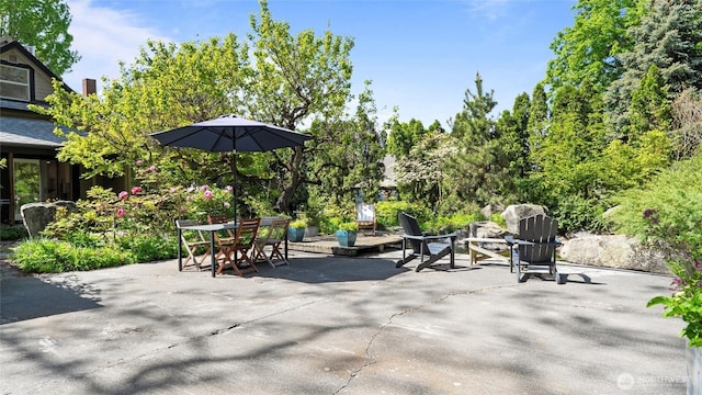 view of patio featuring outdoor dining area