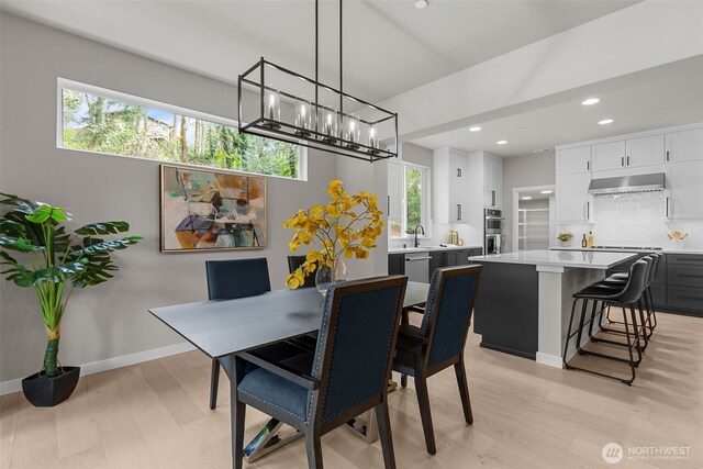 18116 83rd Ave NE, Kenmore, WA 98028 - dining room with recessed lighting, light wood-style floors, baseboards, and an inviting chandelier