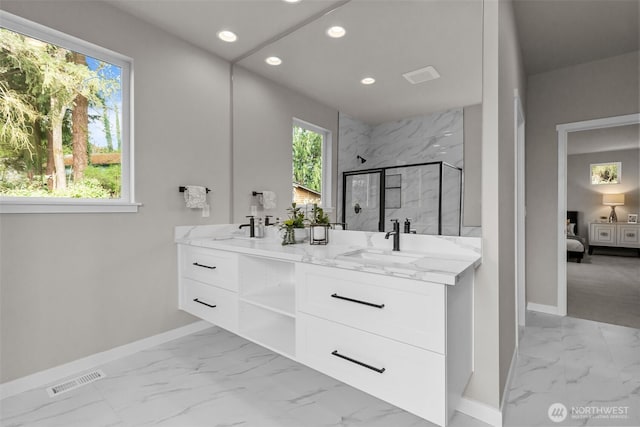 18116 83rd Ave NE, Kenmore, WA 98028 - ensuite bathroom featuring a sink, visible vents, baseboards, and marble finish floor