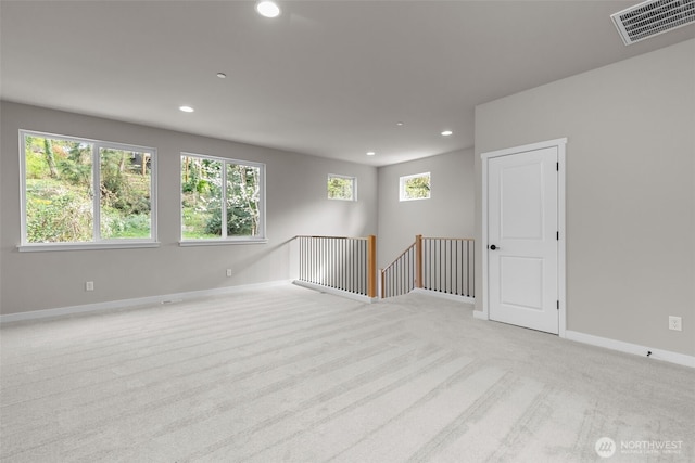18116 83rd Ave NE, Kenmore, WA 98028 - spare room with a healthy amount of sunlight, recessed lighting, visible vents, and carpet floors