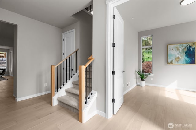 18116 83rd Ave NE, Kenmore, WA 98028 - stairway featuring wood finished floors, baseboards, and visible vents