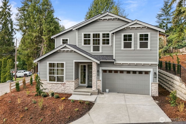 18116 83rd Ave NE, Kenmore, WA 98028 - craftsman-style house featuring concrete driveway, fence, stone siding, and a garage