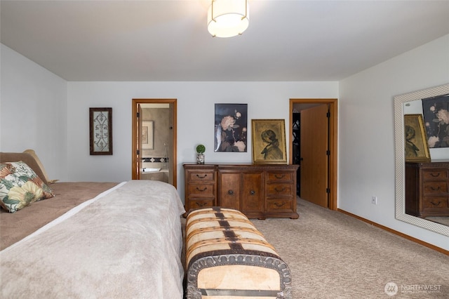 carpeted bedroom with baseboards and connected bathroom