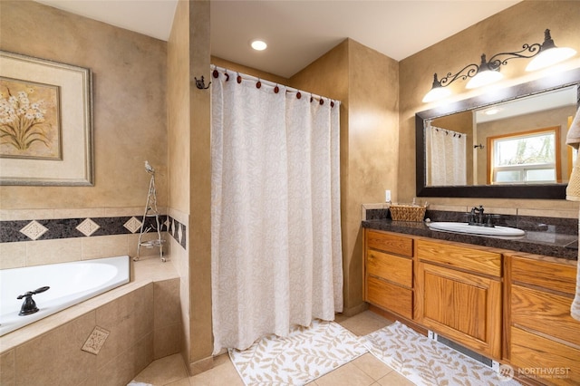 full bath featuring a garden tub, vanity, tile patterned flooring, and a shower with curtain