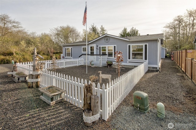 rear view of house with fence