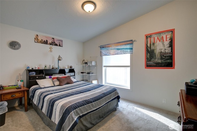 carpeted bedroom featuring vaulted ceiling