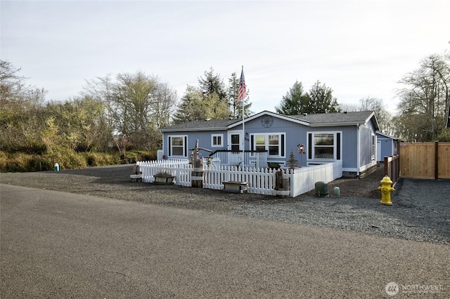 manufactured / mobile home with a fenced front yard