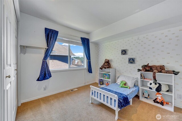 26225 Lake Wilderness Country Club Dr SE, Maple Valley, WA 98038 - bedroom with baseboards, visible vents, and carpet