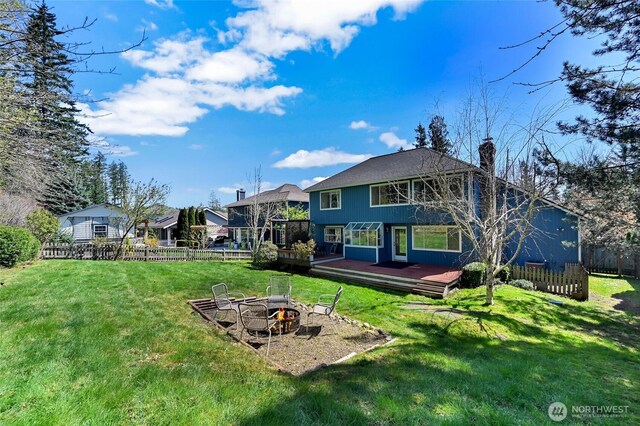 26225 Lake Wilderness Country Club Dr SE, Maple Valley, WA 98038 - back of property featuring fence, an outdoor fire pit, a yard, and a deck