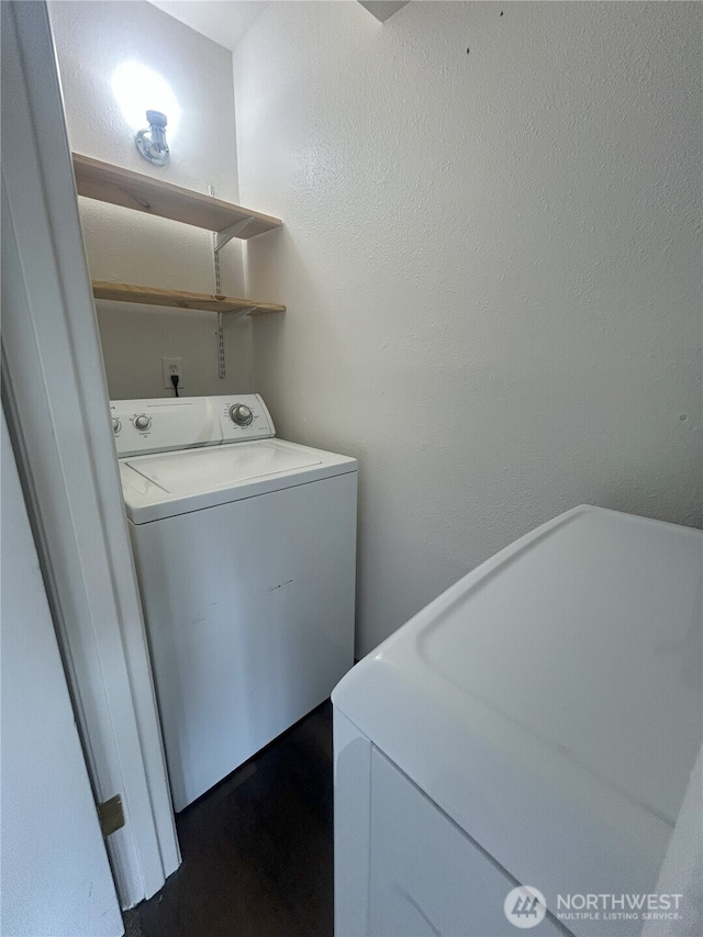 laundry room with washer / dryer, laundry area, and dark wood finished floors