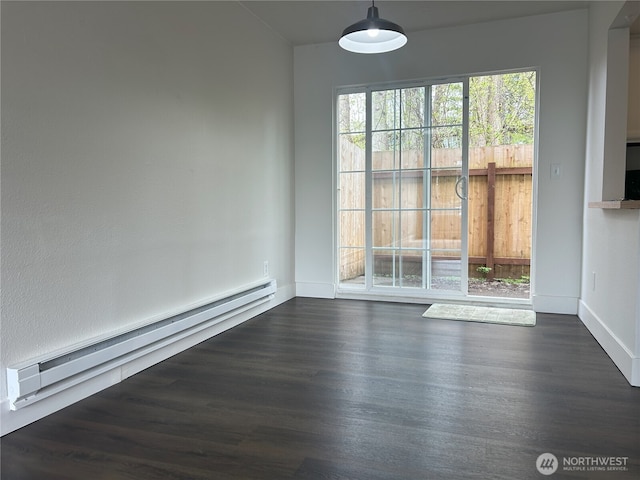 unfurnished dining area with baseboards, a baseboard radiator, and dark wood-style floors