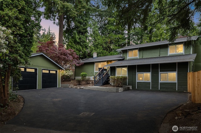 107 219th Pl SE, Bothell, WA 98021 - split level home with fence, a garage, and an outbuilding