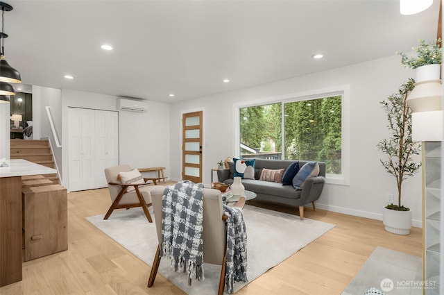 107 219th Pl SE, Bothell, WA 98021 - living room with stairway, light wood-style flooring, a wall mounted AC, and recessed lighting