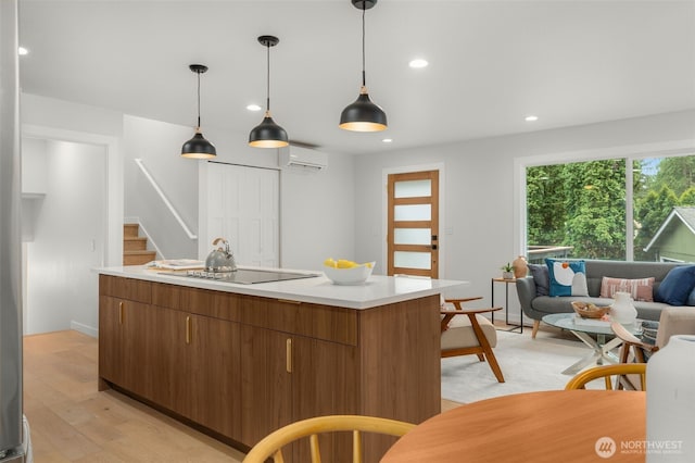 107 219th Pl SE, Bothell, WA 98021 - kitchen with recessed lighting, light wood finished floors, an AC wall unit, light countertops, and black electric cooktop