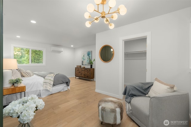 107 219th Pl SE, Bothell, WA 98021 - bedroom with recessed lighting, an inviting chandelier, light wood-style flooring, an AC wall unit, and baseboards
