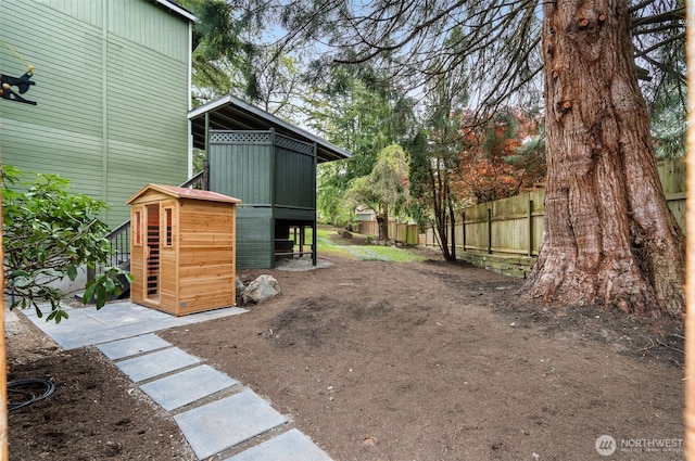 107 219th Pl SE, Bothell, WA 98021 - view of yard with exterior structure, fence, and an outdoor structure