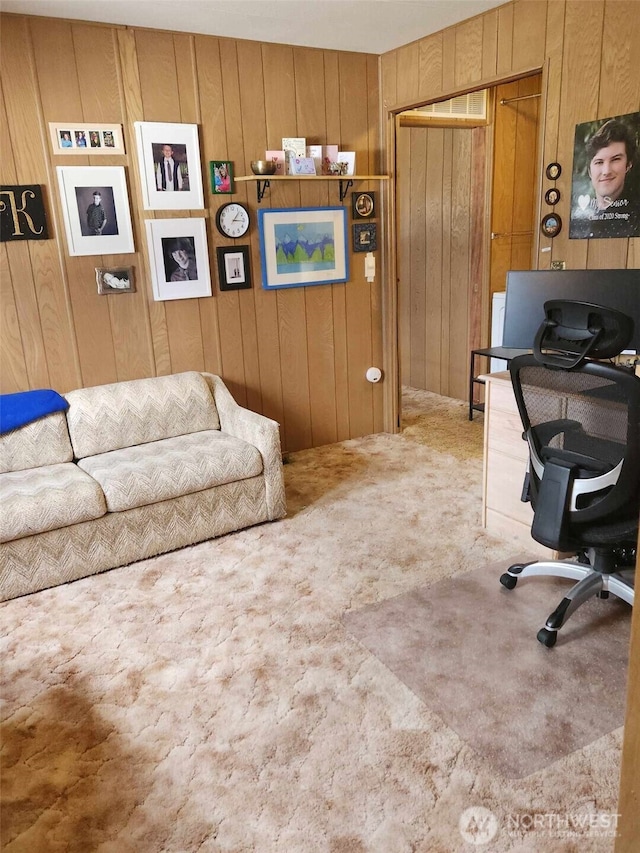 office space with wooden walls and carpet floors