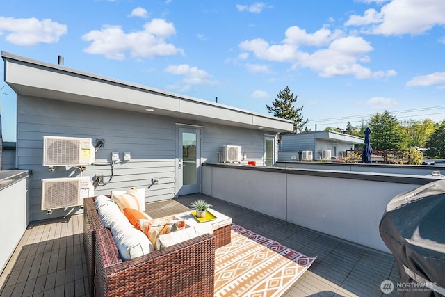 deck with outdoor lounge area and area for grilling