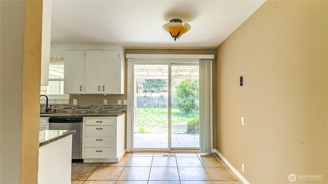 2125 N Highland St, Tacoma, WA 98406 - doorway with baseboards, a sink, and light tile patterned flooring