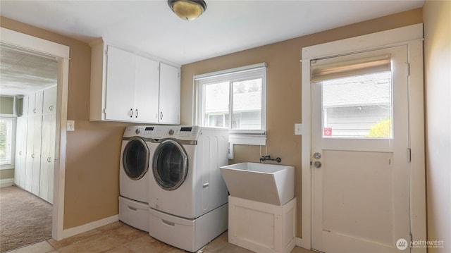 2125 N Highland St, Tacoma, WA 98406 - washroom with a healthy amount of sunlight, a sink, cabinet space, and washing machine and dryer
