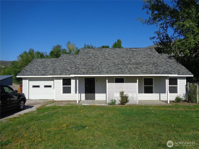 5 Orchard Loop N, Tonasket, WA 98855 - ranch-style home with a porch, a shingled roof, a front lawn, and a garage