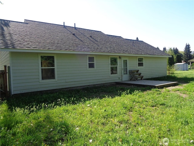 5 Orchard Loop N, Tonasket, WA 98855 - rear view of house with a lawn, a patio, and a shingled roof