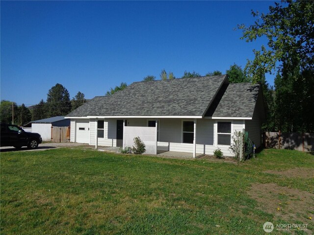 5 Orchard Loop N, Tonasket, WA 98855 - view of front facade featuring roof with shingles, fence, and a front yard