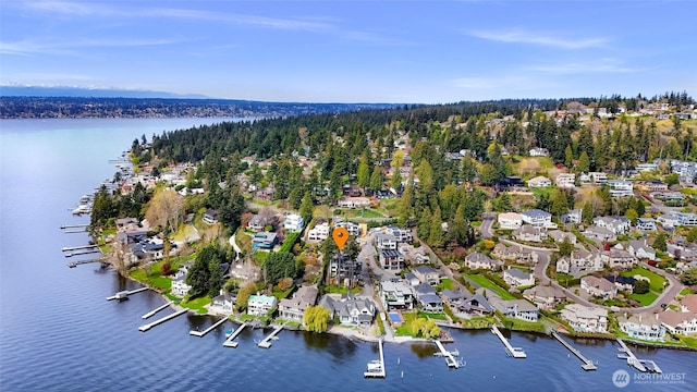 drone / aerial view featuring a water view and a residential view