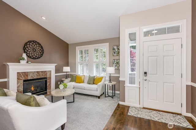 1231 148th Pl SE, Mill Creek, WA 98012 - living area featuring dark wood-style flooring, lofted ceiling, baseboards, and a high end fireplace