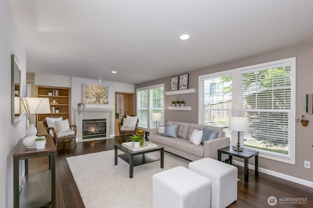 1231 148th Pl SE, Mill Creek, WA 98012 - living area featuring dark wood-style flooring, baseboards, a tiled fireplace, and recessed lighting
