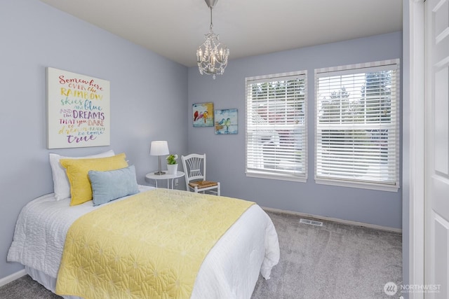 1231 148th Pl SE, Mill Creek, WA 98012 - carpeted bedroom with baseboards and a chandelier