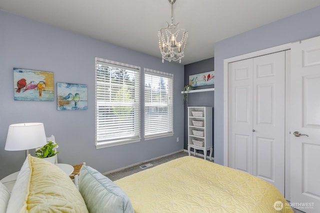1231 148th Pl SE, Mill Creek, WA 98012 - bedroom with a closet, a chandelier, and baseboards