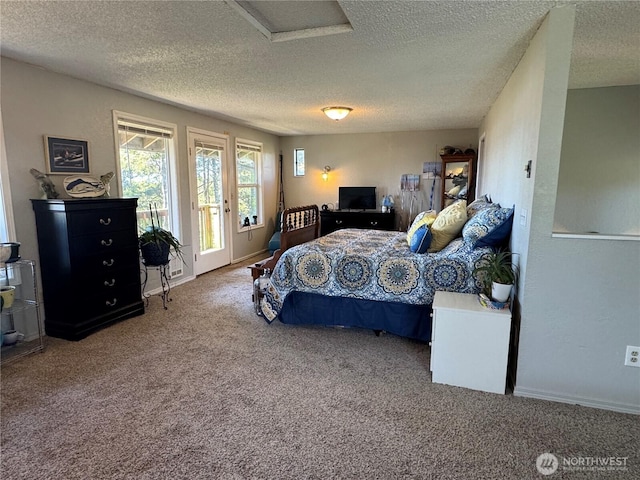 4751 State Route 109, Moclips, WA 98562 - bedroom with a textured ceiling, access to exterior, carpet, and baseboards