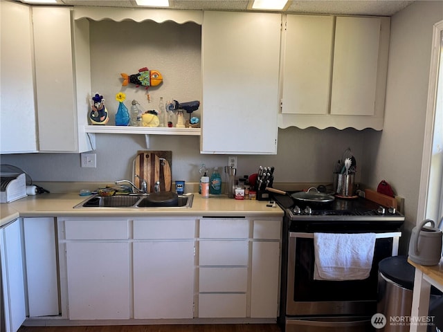 4751 State Route 109, Moclips, WA 98562 - kitchen featuring stainless steel electric range oven, a sink, light countertops, white cabinetry, and open shelves