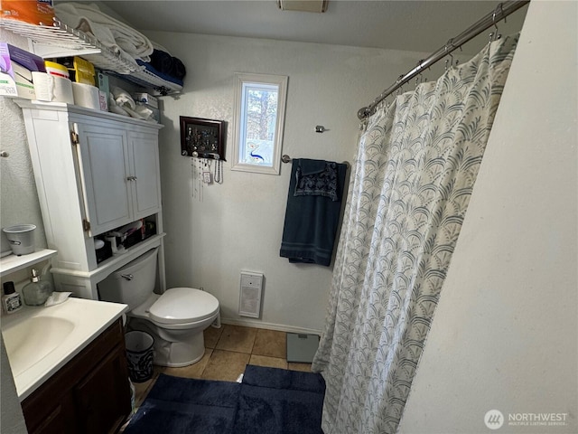 4751 State Route 109, Moclips, WA 98562 - full bath featuring tile patterned flooring, toilet, vanity, baseboards, and curtained shower