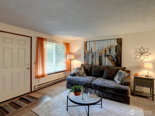 living room featuring a textured ceiling, baseboard heating, and wood finished floors