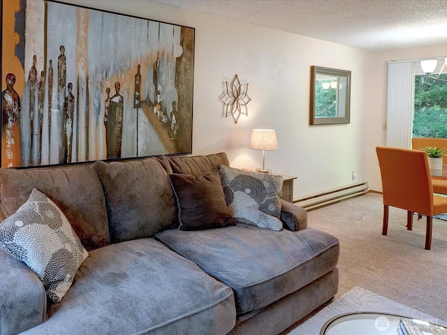 living room with baseboards, a baseboard radiator, carpet flooring, and a textured ceiling
