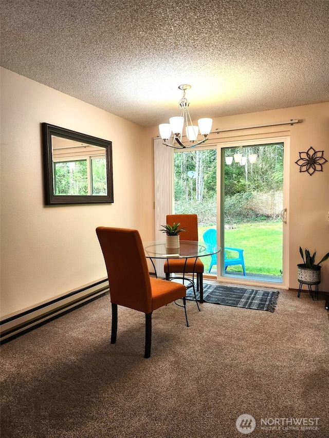 dining room featuring an inviting chandelier, carpet flooring, a baseboard heating unit, and a textured ceiling