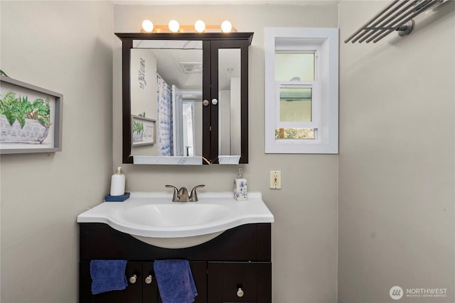 bathroom featuring visible vents and vanity