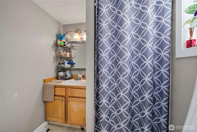 full bathroom featuring tile patterned floors, a shower with shower curtain, and vanity
