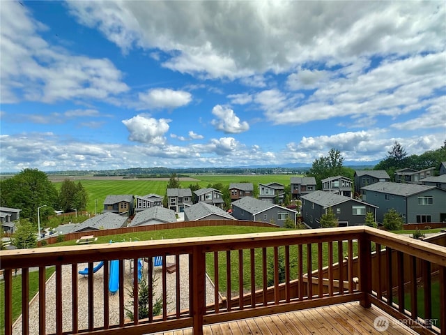wooden deck featuring a residential view