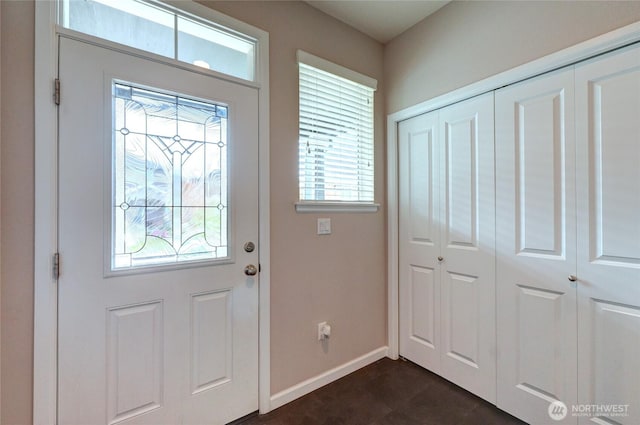 foyer entrance with baseboards