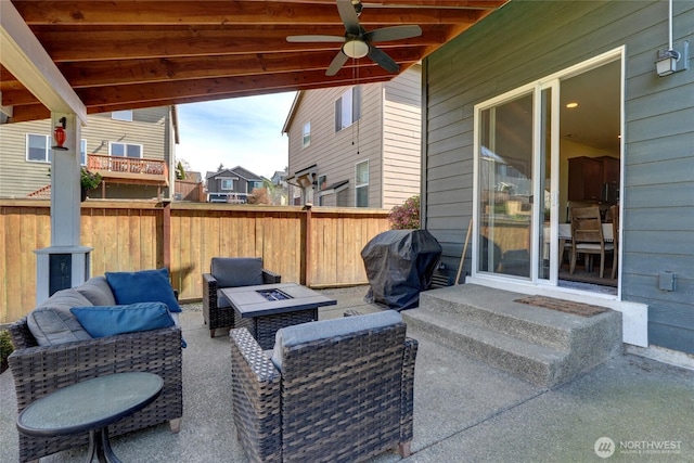 view of patio / terrace featuring entry steps, fence, an outdoor living space with a fire pit, ceiling fan, and grilling area