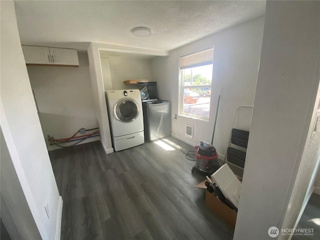 105 E 13th Ave, Kennewick, WA 99337 - laundry room with washer / clothes dryer and dark wood-style flooring