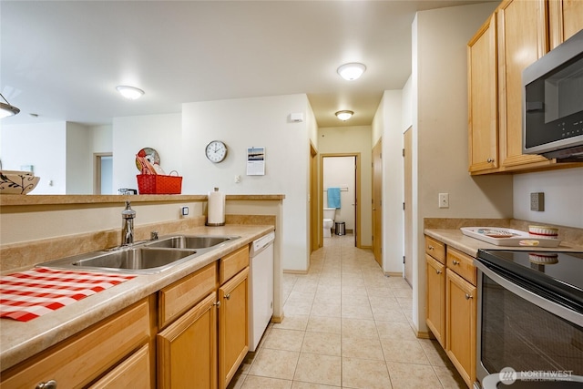 500 Darby Dr Unit A-304, Bellingham, WA 98226 - kitchen with light tile patterned floors, stainless steel microwave, a sink, dishwasher, and electric stove