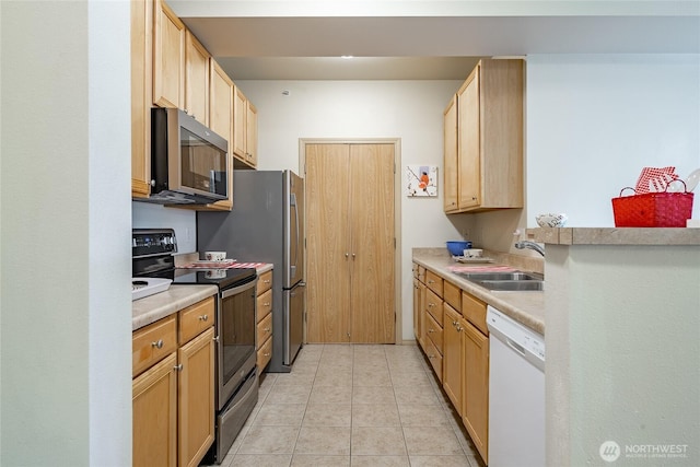 500 Darby Dr Unit A-304, Bellingham, WA 98226 - kitchen featuring stainless steel microwave, light countertops, range with electric cooktop, dishwasher, and a sink