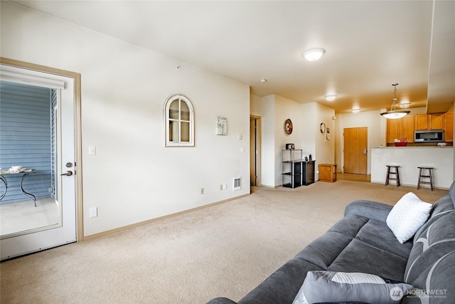 500 Darby Dr Unit A-304, Bellingham, WA 98226 - living area featuring visible vents, light colored carpet, and baseboards