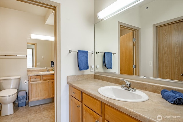 500 Darby Dr Unit A-304, Bellingham, WA 98226 - bathroom with tile patterned floors, two vanities, a sink, and toilet