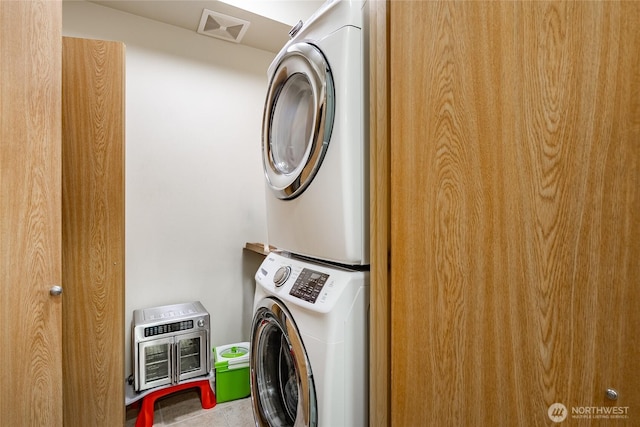 500 Darby Dr Unit A-304, Bellingham, WA 98226 - clothes washing area featuring stacked washer / dryer, visible vents, and heating unit