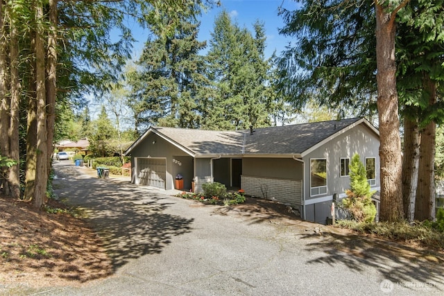 9376 Mercerwood Dr, Mercer Island, WA 98040 - view of front of property with driveway and a garage
